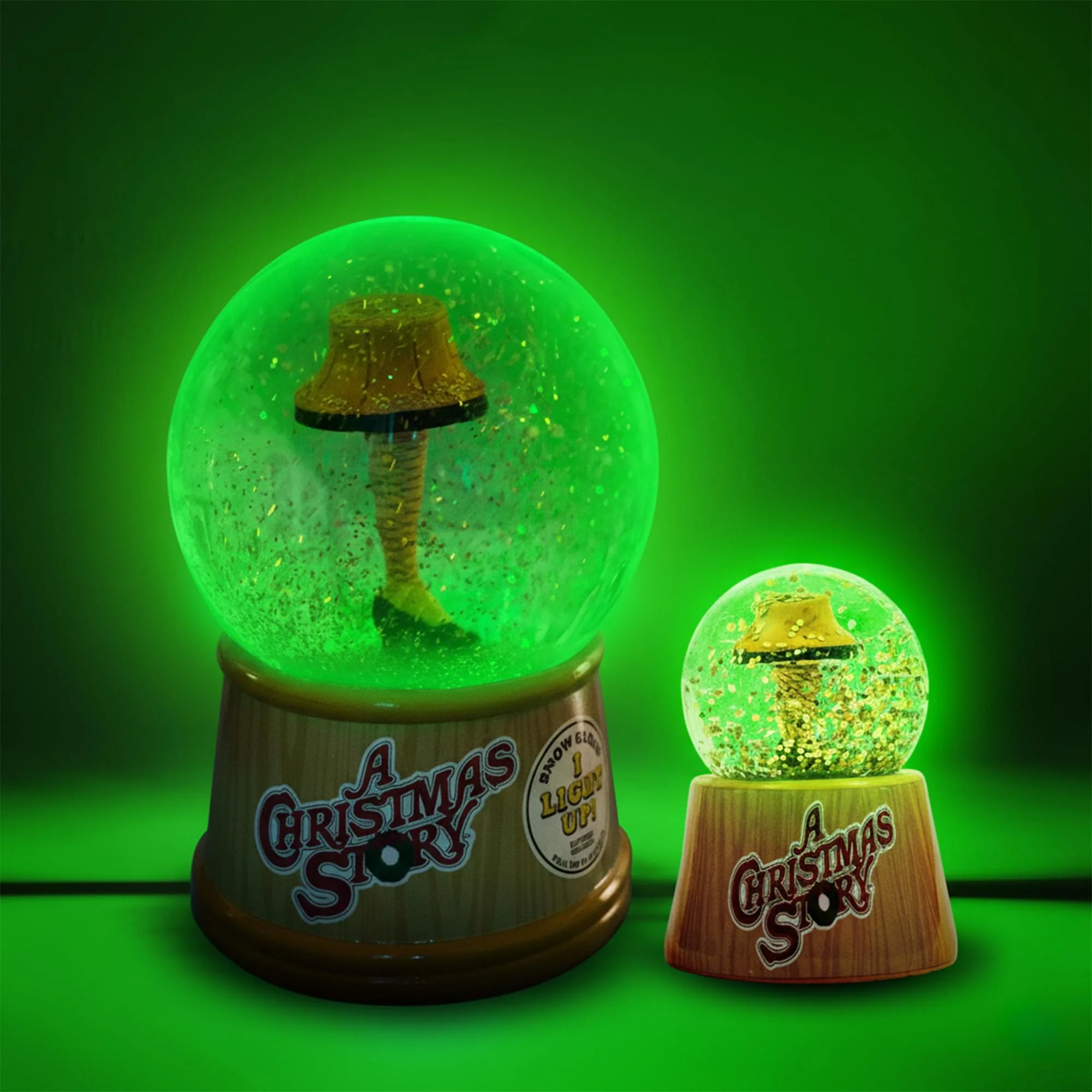 A Christmas Story Leg Lamp 3-Inch Mini and 6-Inch Large Light-Up Snow Globe Set - Image 3